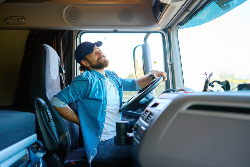 Truck driver holding his lower back in pain