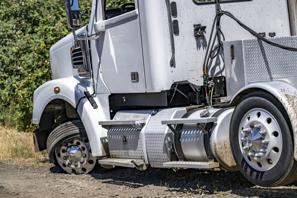 Commercial truck with visible collision damage